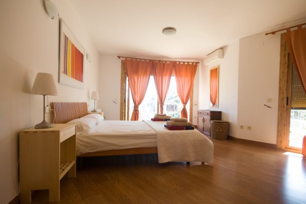 Bedroom 1 - Large double with en suite bathroom - two French windows leading out to the balcony with views of the sea